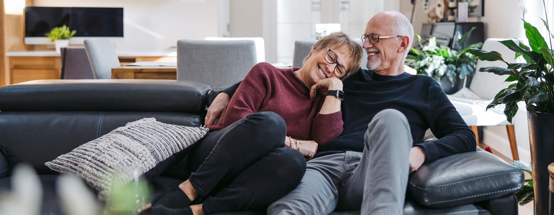 a man and woman sitting on a couch